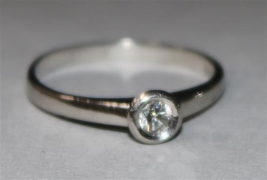 A platinum and solitaire diamond ring. size M.